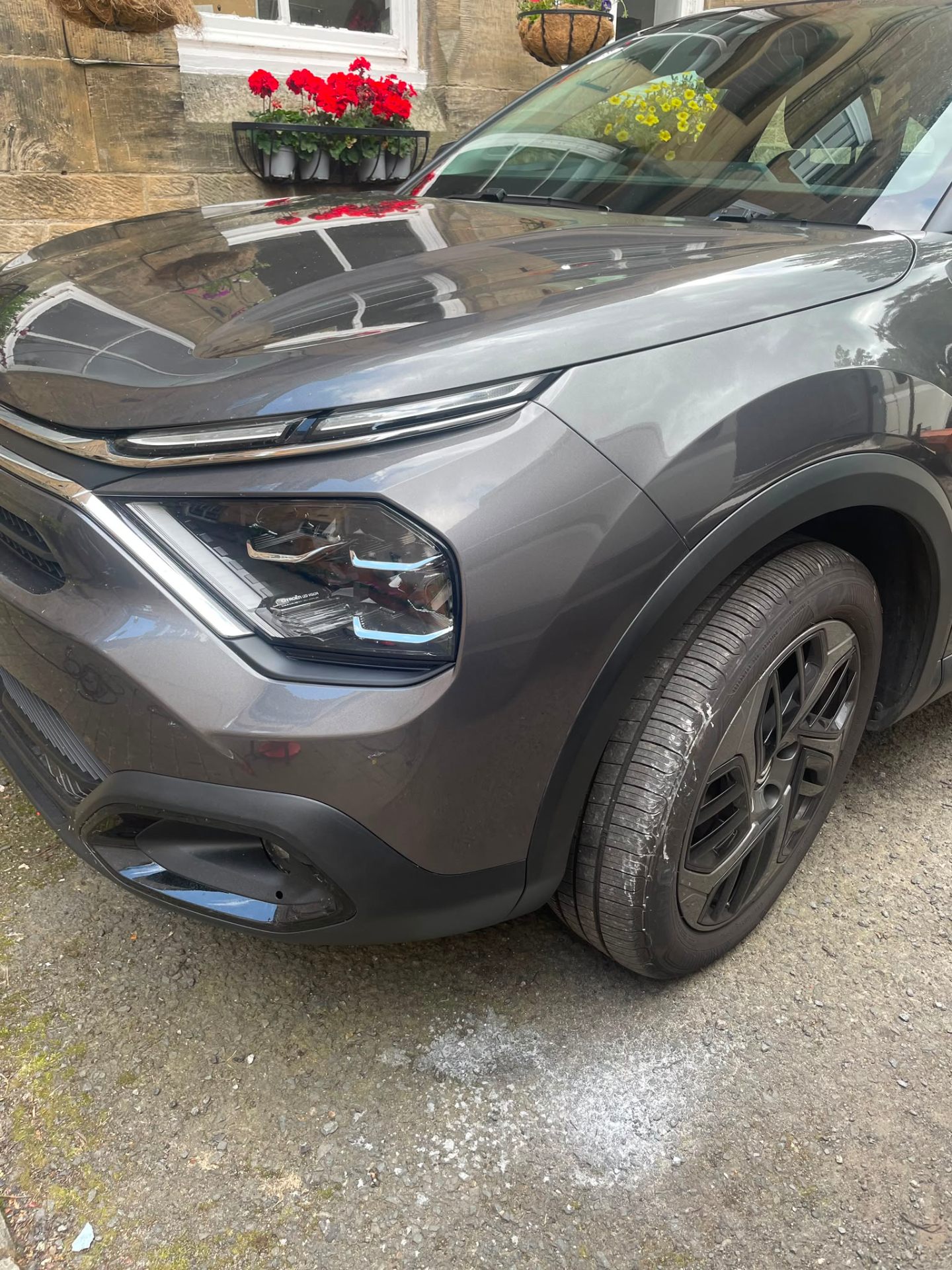 Citroen C3 grey front bumper repair finished on customer driveway